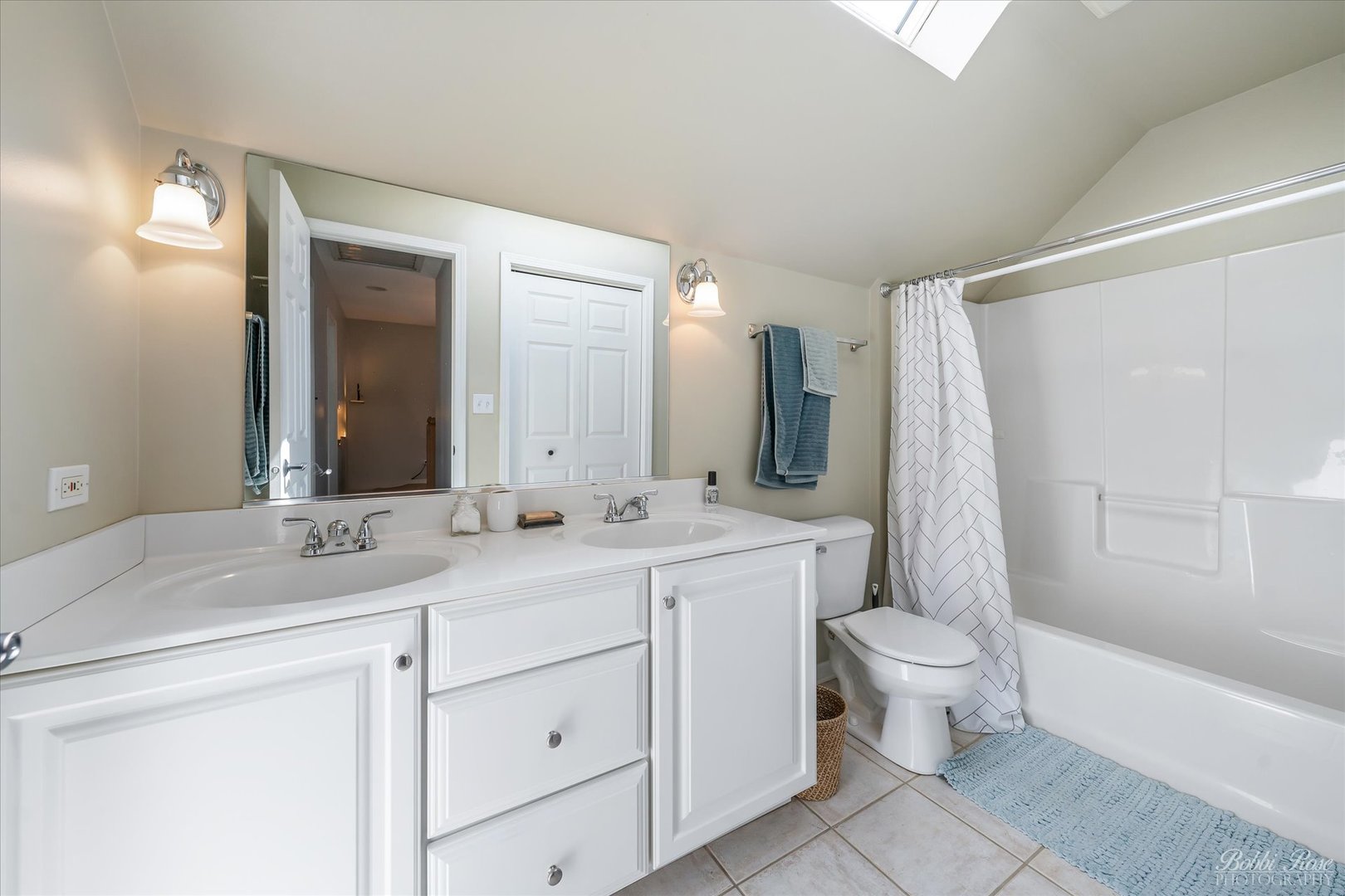439 South Church Road Bensenville, IL 60106 - Photo 30 of 49 a bathroom with a double vanity sink toilet mirror and bathtub