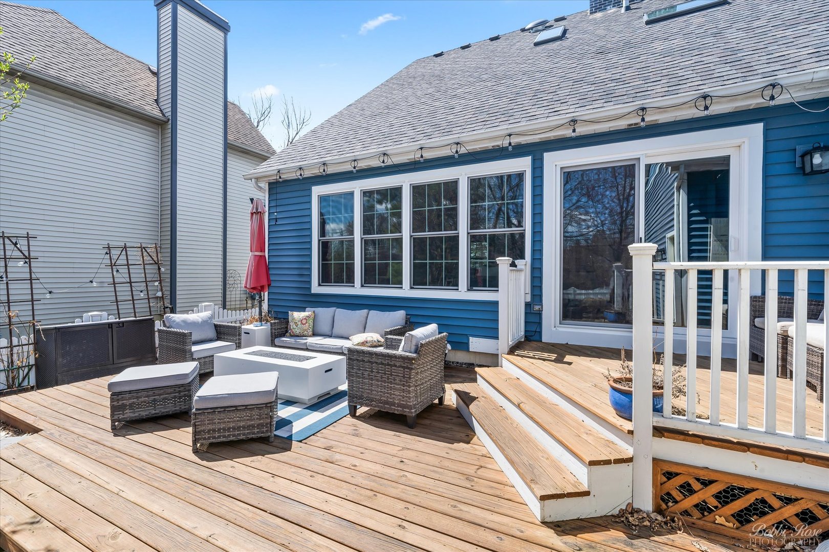439 South Church Road Bensenville, IL 60106 - Photo 41 of 49 a view of a deck with couches table and chairs with wooden floor