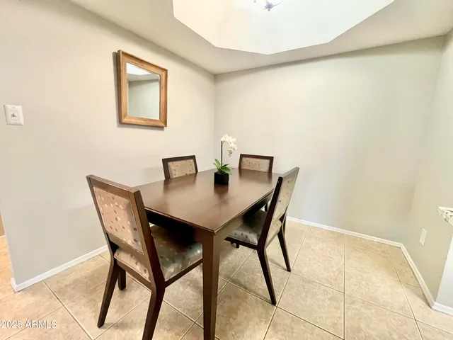 a view of a dining room with furniture and window
