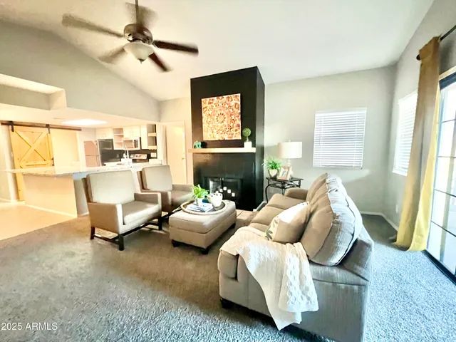 a living room with furniture and a window