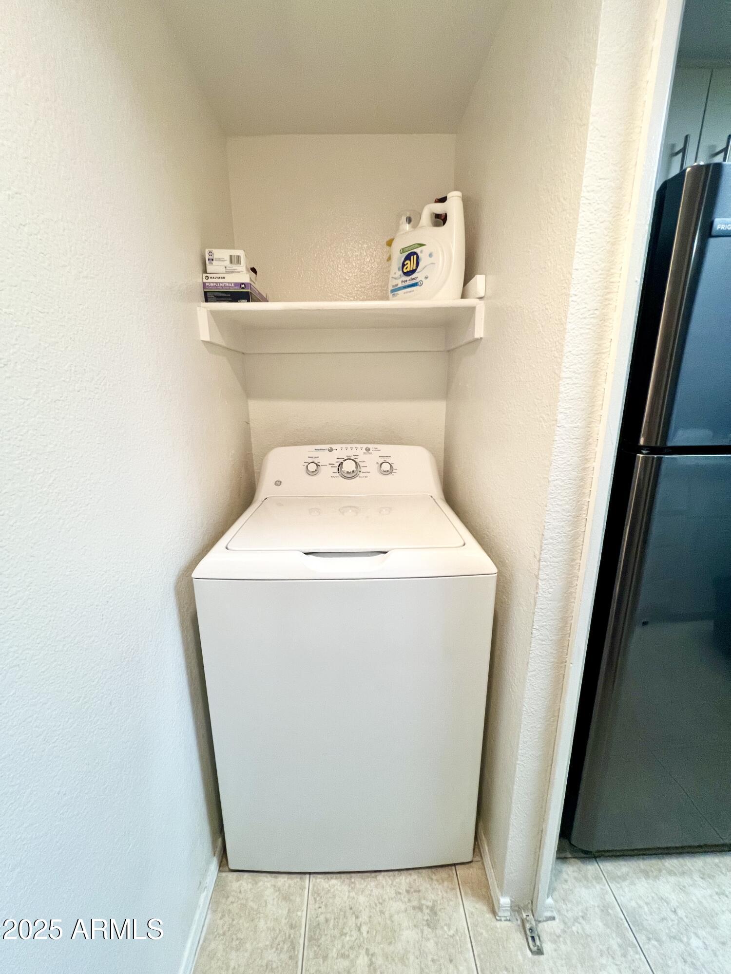 2855 South Ext Road, Unit 220 Mesa, AZ 85210 - Photo 31 of 40 a utility room with dryer and washer