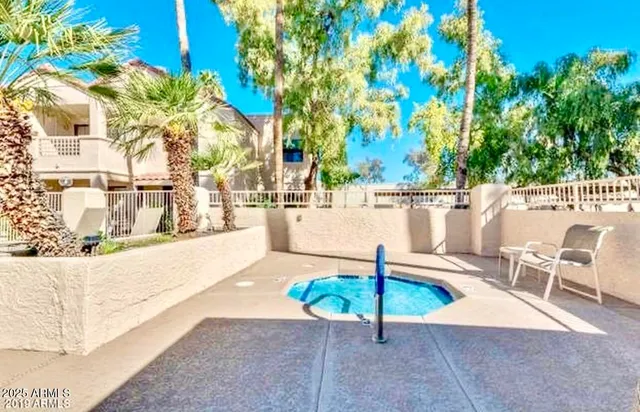 a view of a swimming pool with a patio