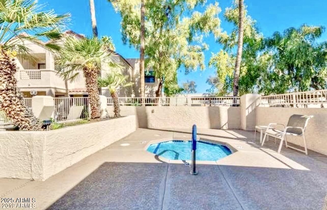 2855 South Ext Road, Unit 220 Mesa, AZ 85210 - Photo 33 of 40 a view of a swimming pool with a patio
