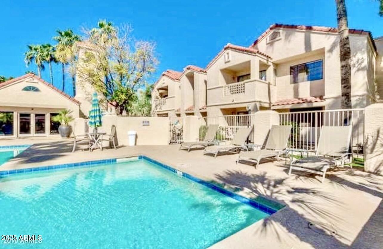 2855 South Ext Road, Unit 220 Mesa, AZ 85210 - Photo 36 of 40 a view of a house with backyard porch and patio