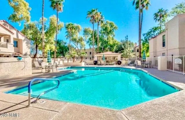 a view of a swimming pool with a lounge chairs