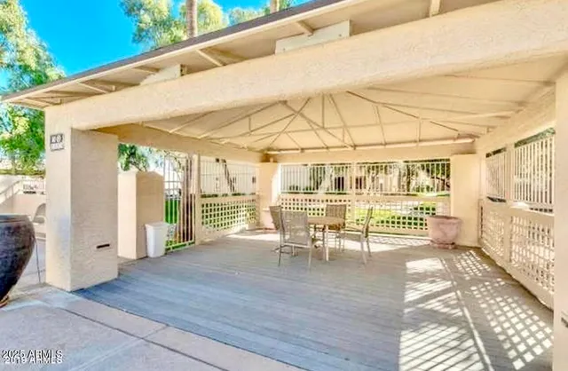 a dining room with wooden floor and outdoor space