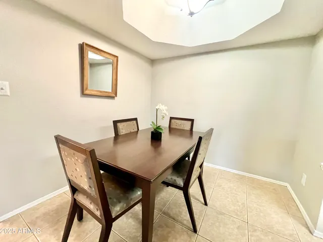 a view of a dining room with furniture and a table
