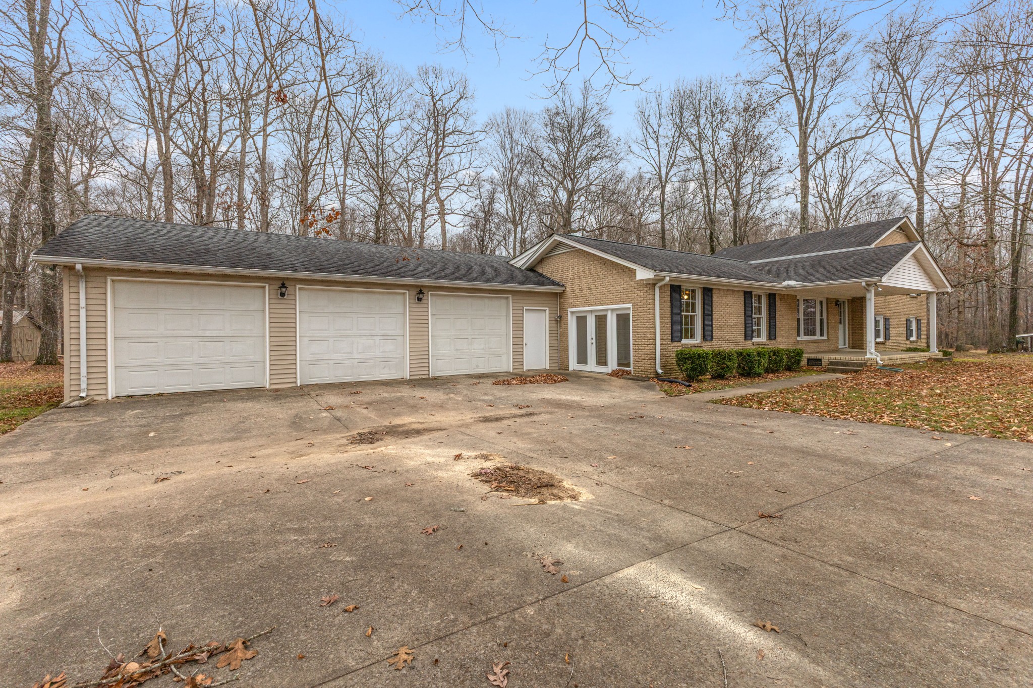 698 Houston Fielder Road Clarksville, TN 37043 - Photo 2 of 61 a front view of a house with a yard and garage
