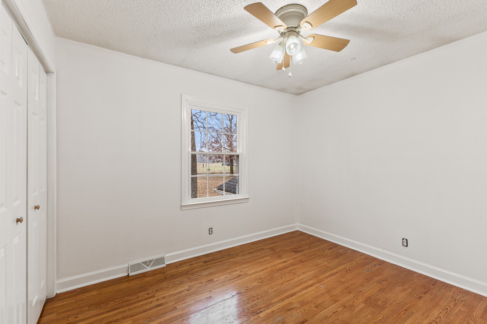 698 Houston Fielder Road Clarksville, TN 37043 - Photo 22 of 61 an empty room with a window and a fan