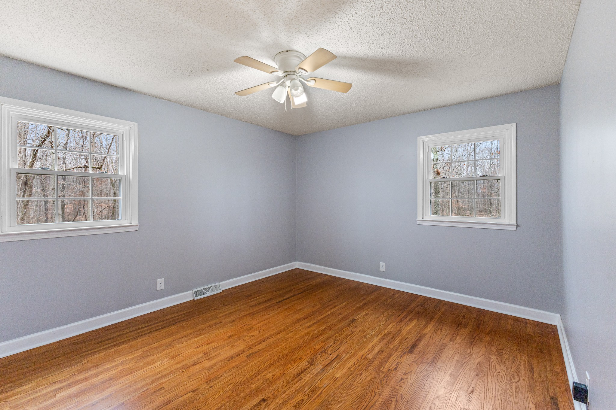 698 Houston Fielder Road Clarksville, TN 37043 - Photo 27 of 61 a view of empty room with wooden floor and fan