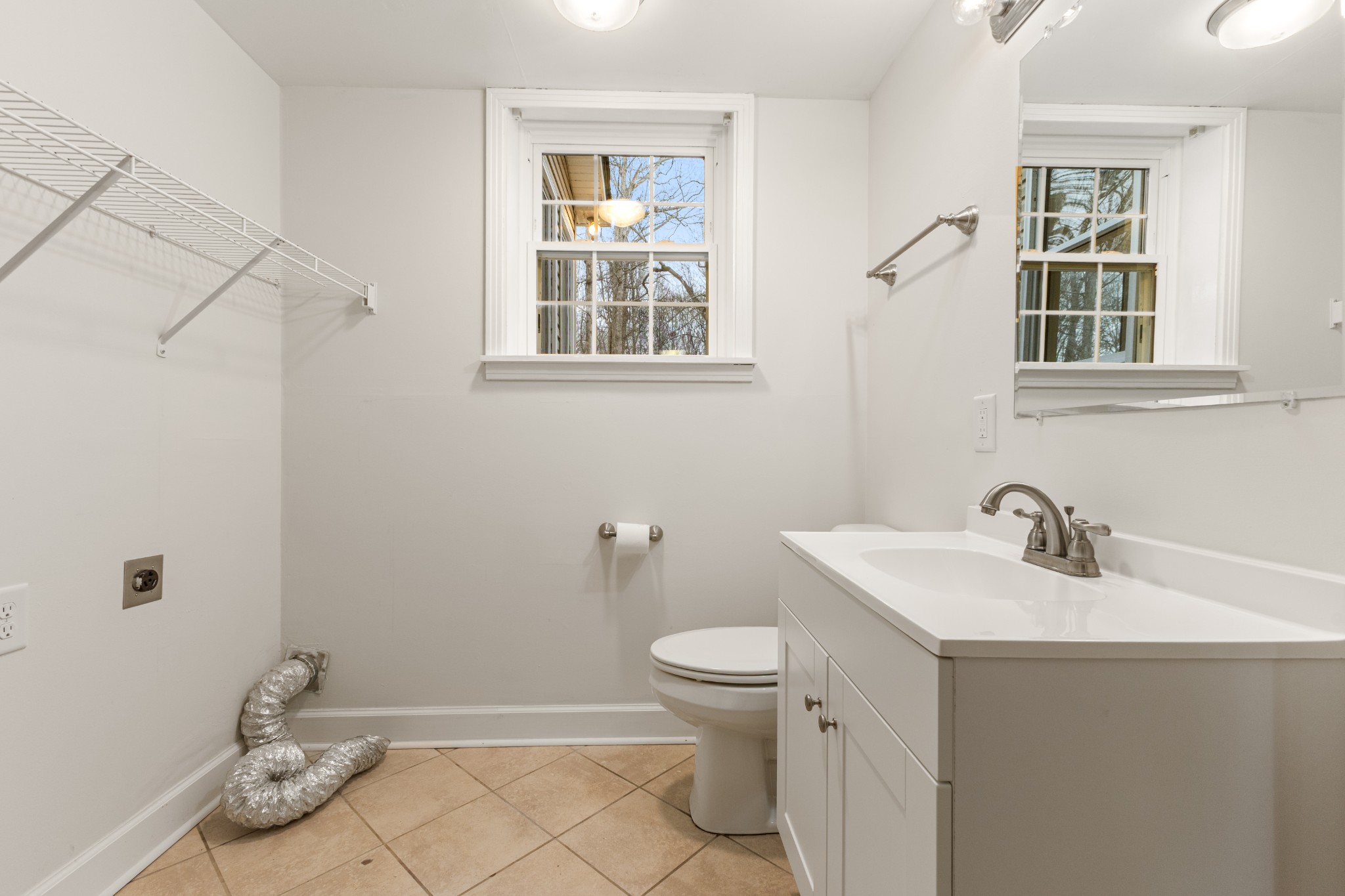 698 Houston Fielder Road Clarksville, TN 37043 - Photo 32 of 61 a bathroom with a sink toilet and a window