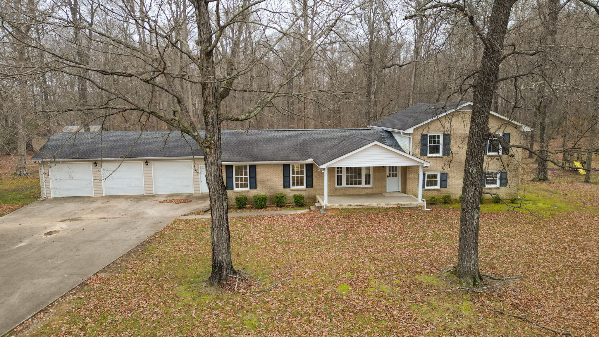698 Houston Fielder Road Clarksville, TN 37043 - Photo 53 of 61 a front view of a house with a yard and garage