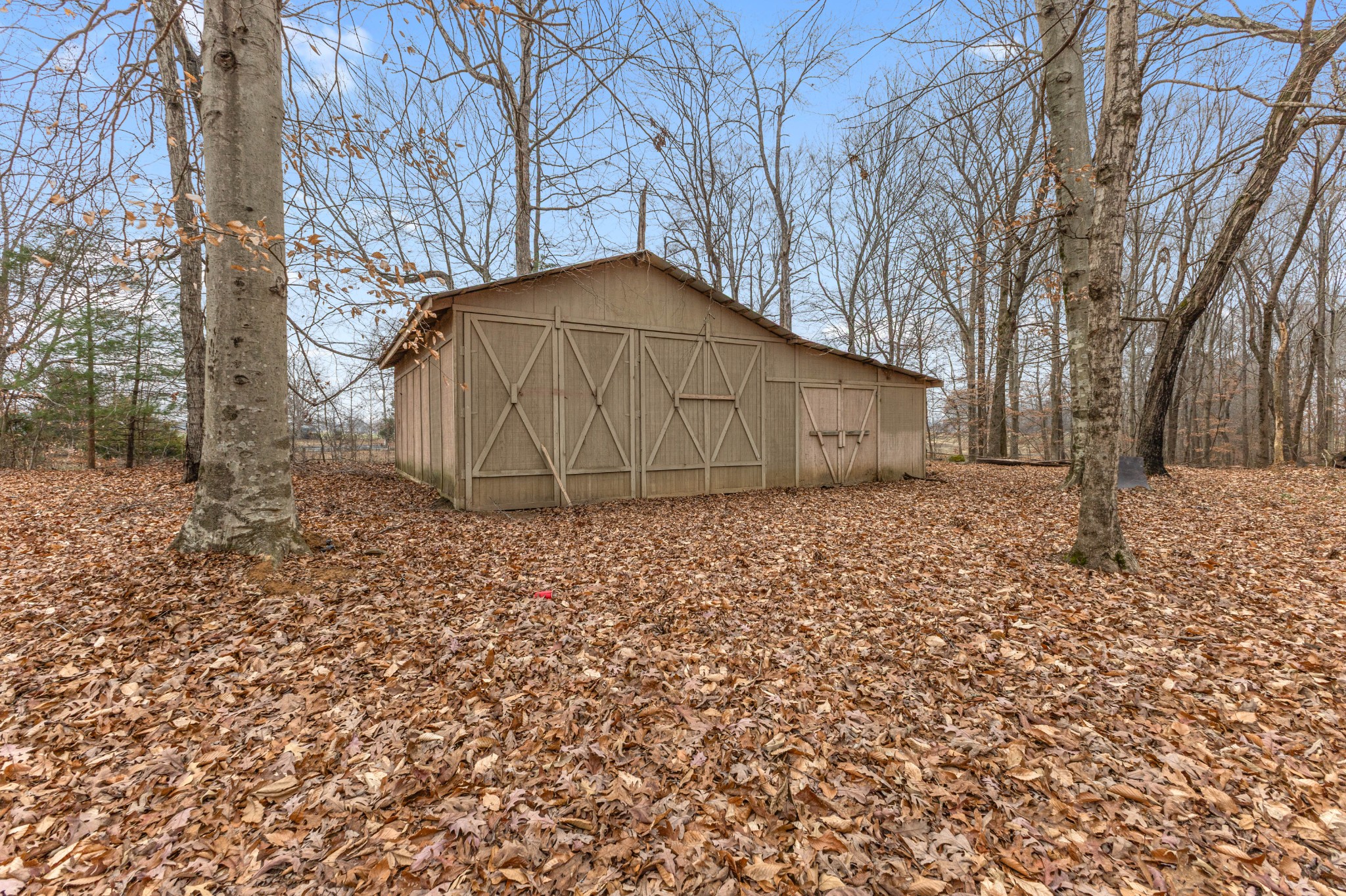 698 Houston Fielder Road Clarksville, TN 37043 - Photo 9 of 61 a house with trees in front of it