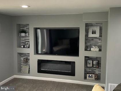 10848 Perrin Road Philadelphia, PA 19154 - Photo 21 of 38 a living room with flat screen tv and a fireplace