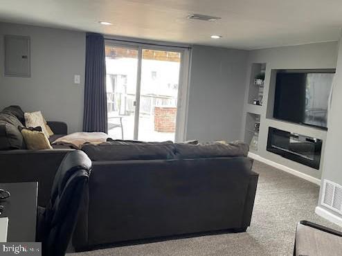 10848 Perrin Road Philadelphia, PA 19154 - Photo 22 of 38 a living room with furniture and a flat screen tv