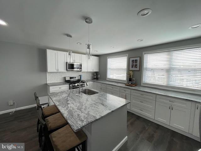 10848 Perrin Road Philadelphia, PA 19154 - Photo 7 of 38 a kitchen with sink cabinets and window