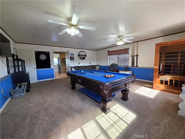 a bedroom with a bed and a ceiling fan