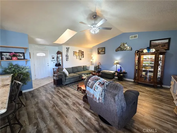 a bedroom with furniture and a chandelier