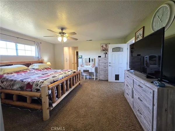 a room with pool table and windows