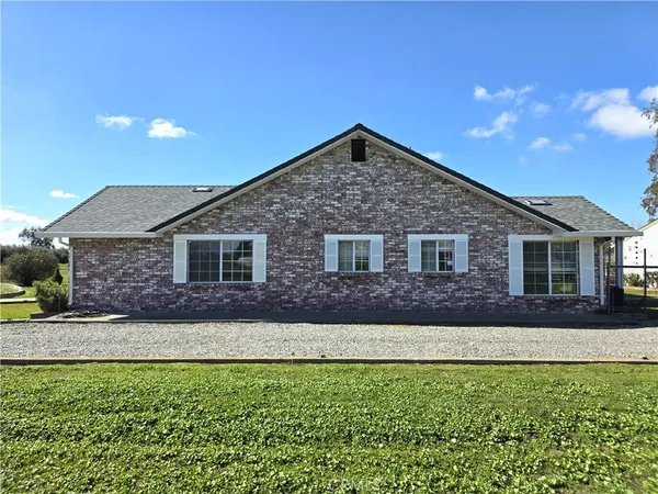 a view of yard with swimming pool and green space