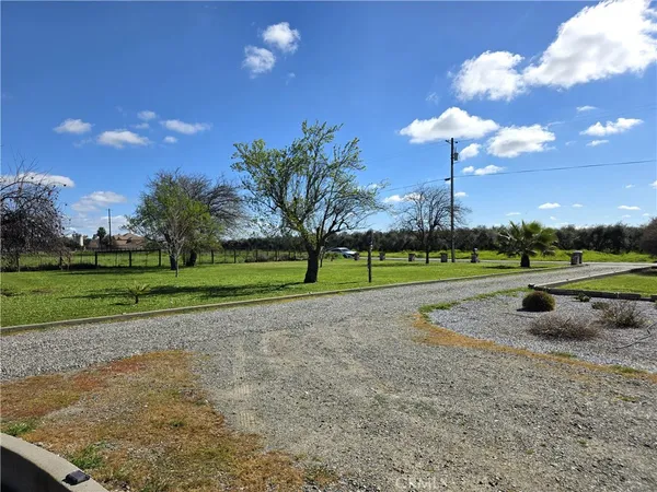 a view of yard with swimming pool and lake view