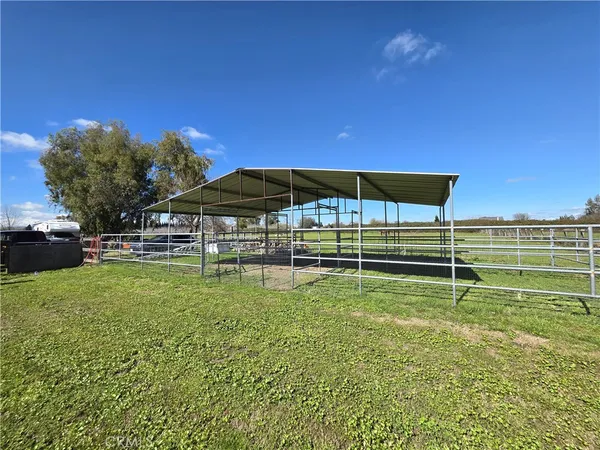 a view of a green field with clear sky