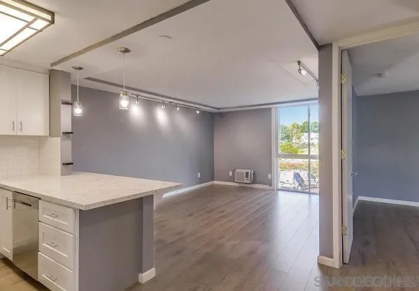a view of an empty room and window