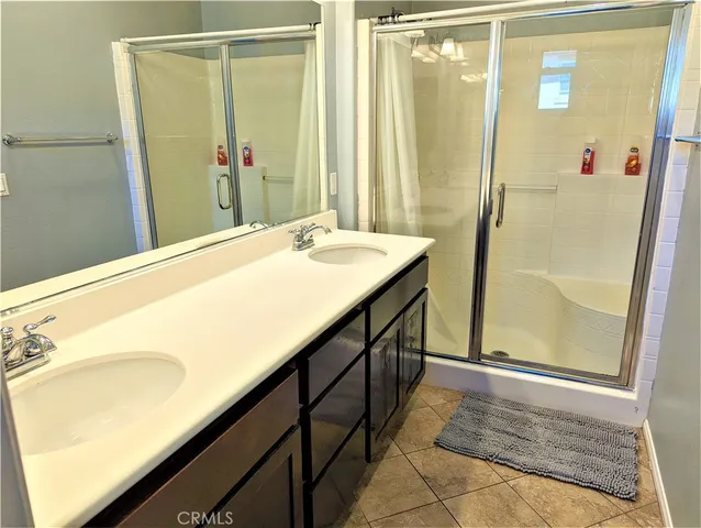 a view of a bathroom with a tub and shower