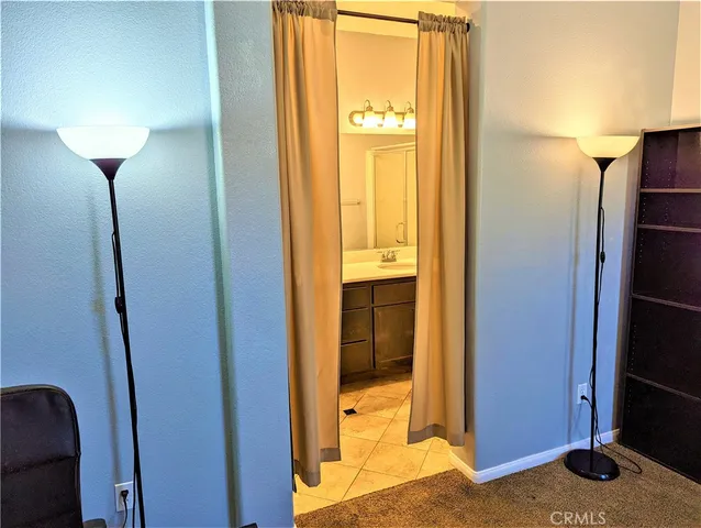 a bed room with a bed and dresser