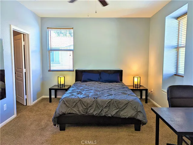 a bedroom with a bed and a closet