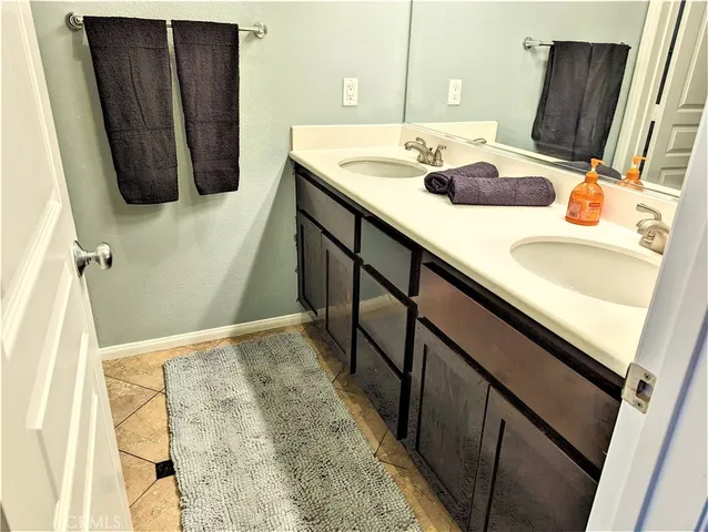 a view of a room with a door and wooden floor