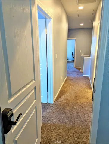 a view of a room that has a bed