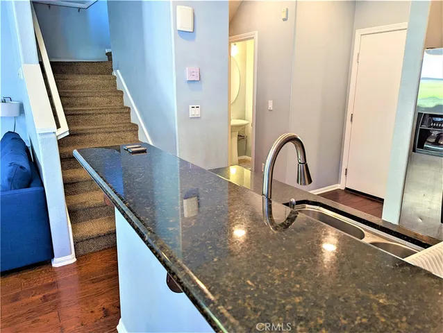 a view of a swimming pool with a dining space