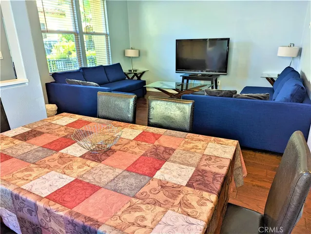 a bedroom with a bed and flat screen tv