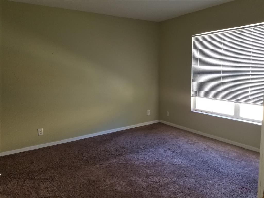 219 Drawbridge Lane Valrico, FL 33594 - Photo 12 of 24 an empty room with a window