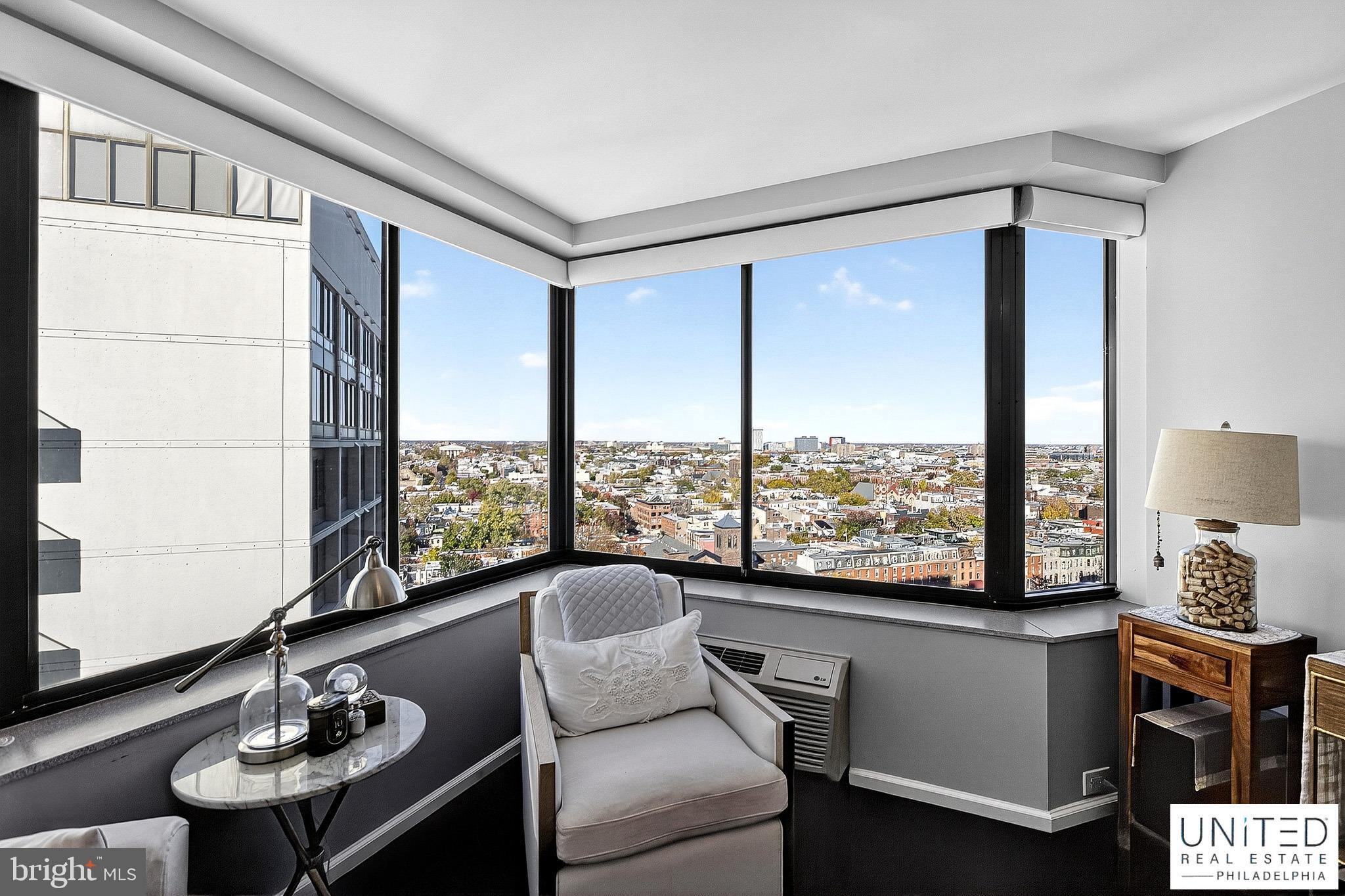 2001 Hamilton Street, Unit 2001 Philadelphia, PA 19130 - Photo 13 of 46 a living room with furniture and a large window