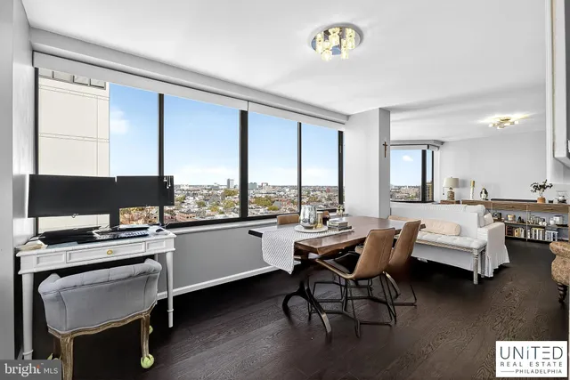 a room with furniture pool table and flat screen tv