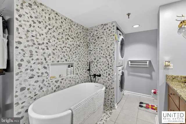 a bathroom with a bathtub and shower