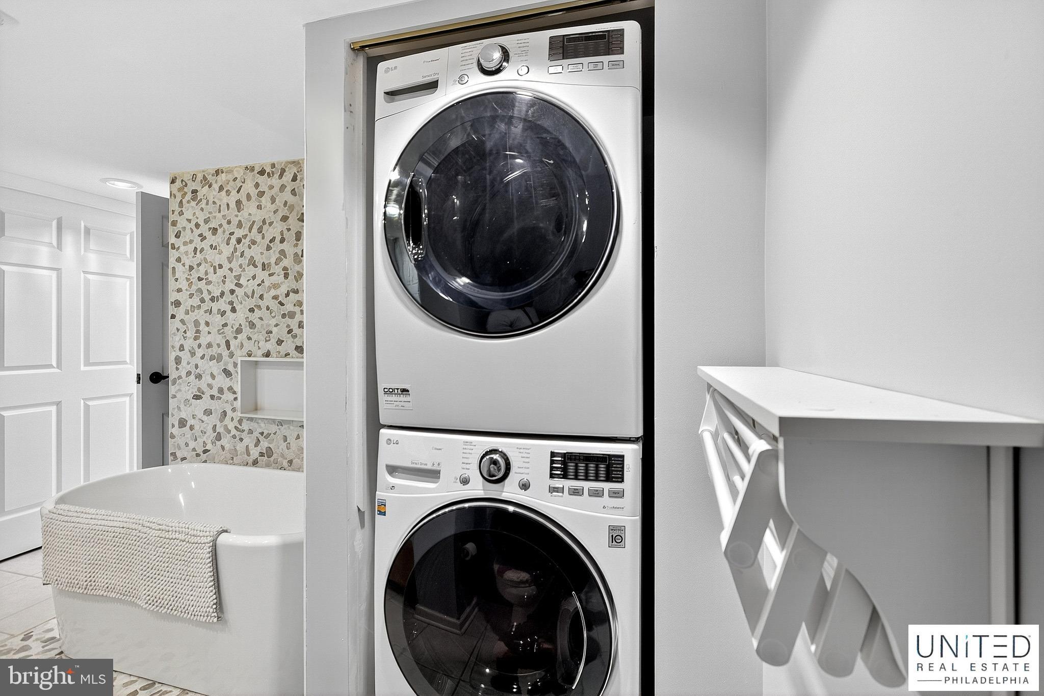 2001 Hamilton Street, Unit 2001 Philadelphia, PA 19130 - Photo 31 of 46 a view of a hallway with washer and dryer