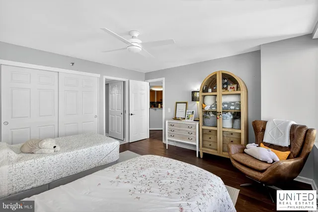 a bedroom with furniture and wooden floor