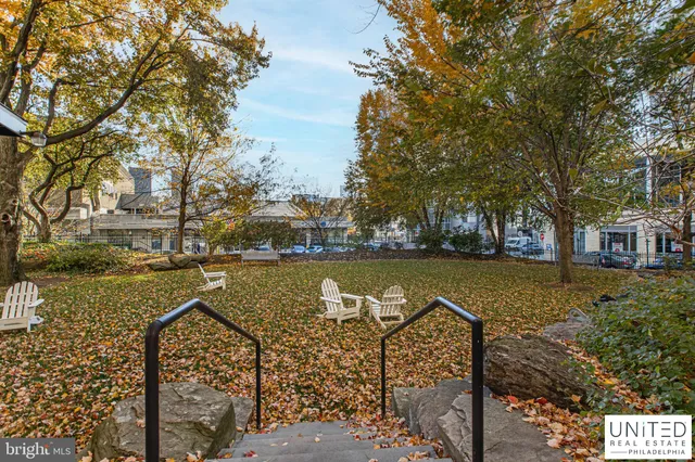 a view of a lake with houses next to a yard