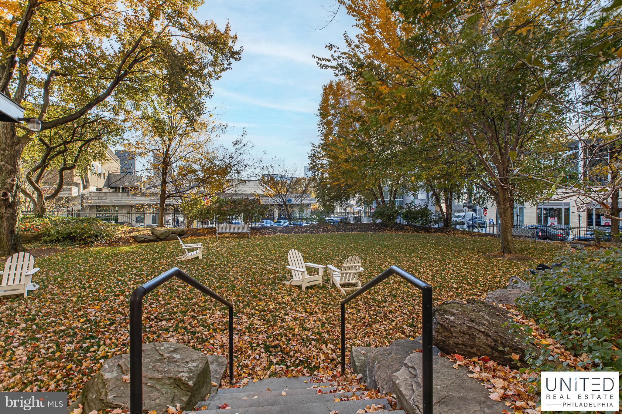 2001 Hamilton Street, Unit 2001 Philadelphia, PA 19130 - Photo 39 of 46 a view of a lake with houses next to a yard