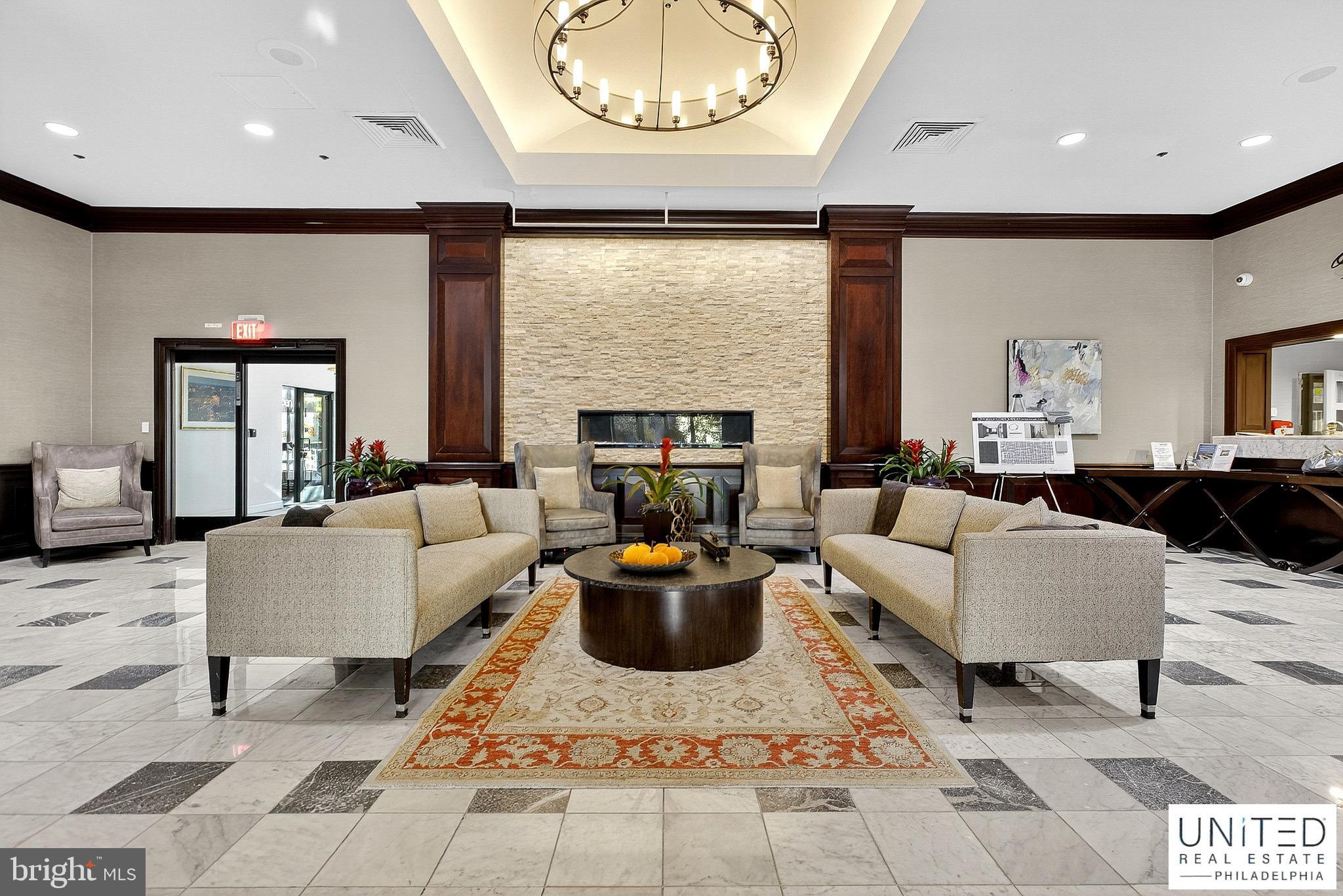 2001 Hamilton Street, Unit 2001 Philadelphia, PA 19130 - Photo 4 of 46 a living room with fireplace furniture and a large window