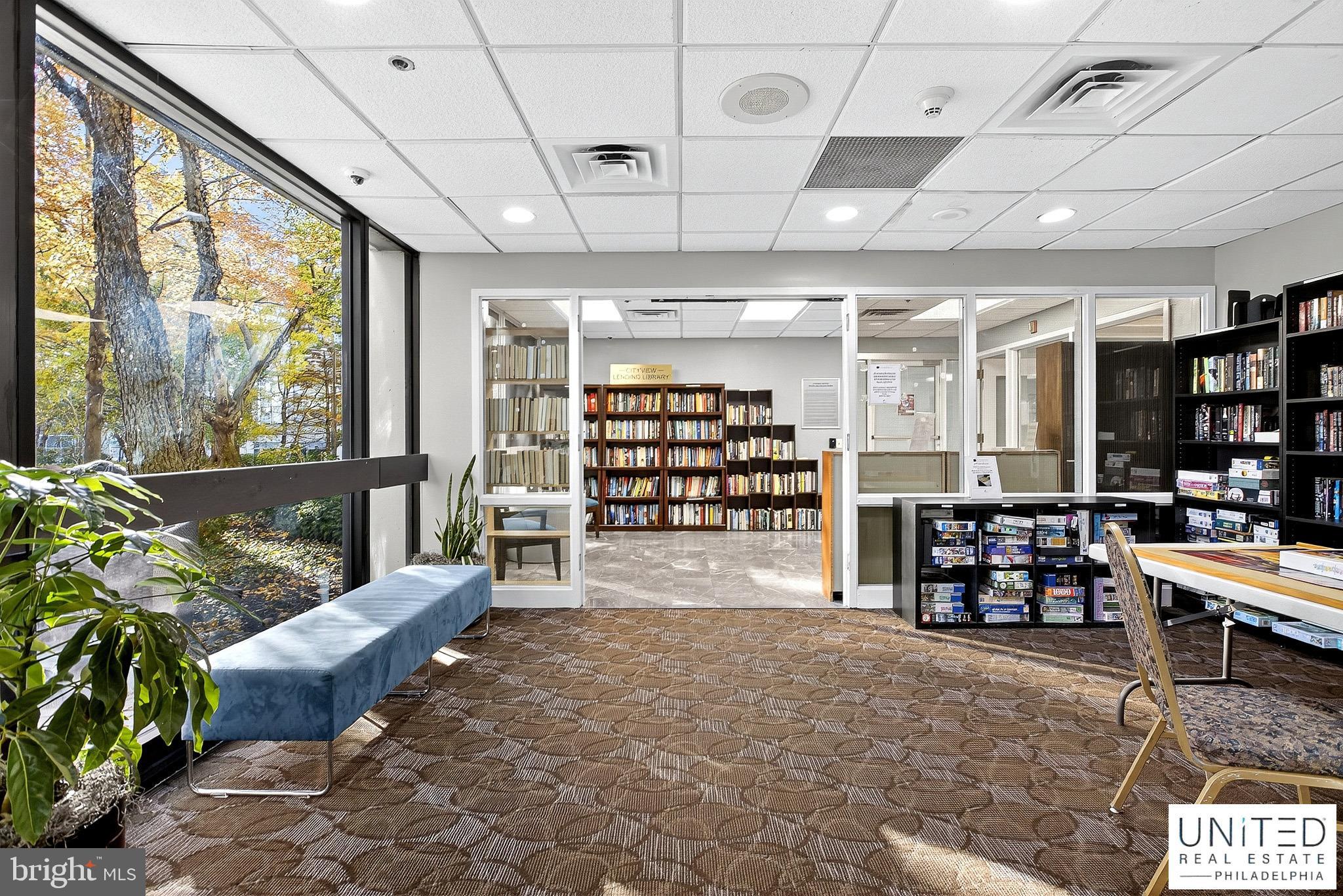 2001 Hamilton Street, Unit 2001 Philadelphia, PA 19130 - Photo 43 of 46 a room with lots of wooden furniture and a large window