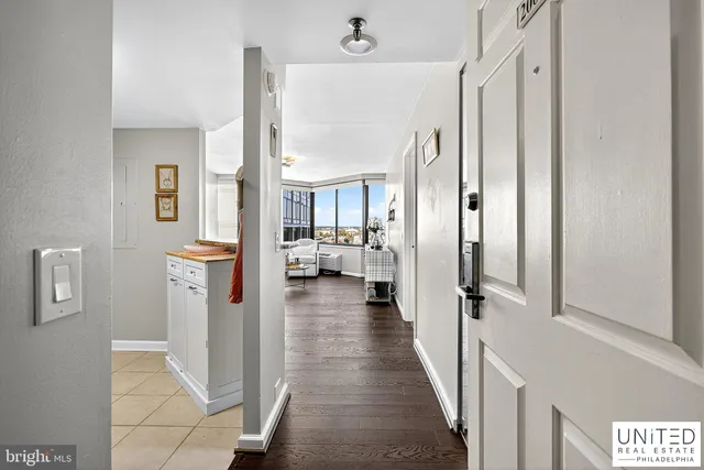 a view of a bathroom with tub and windows