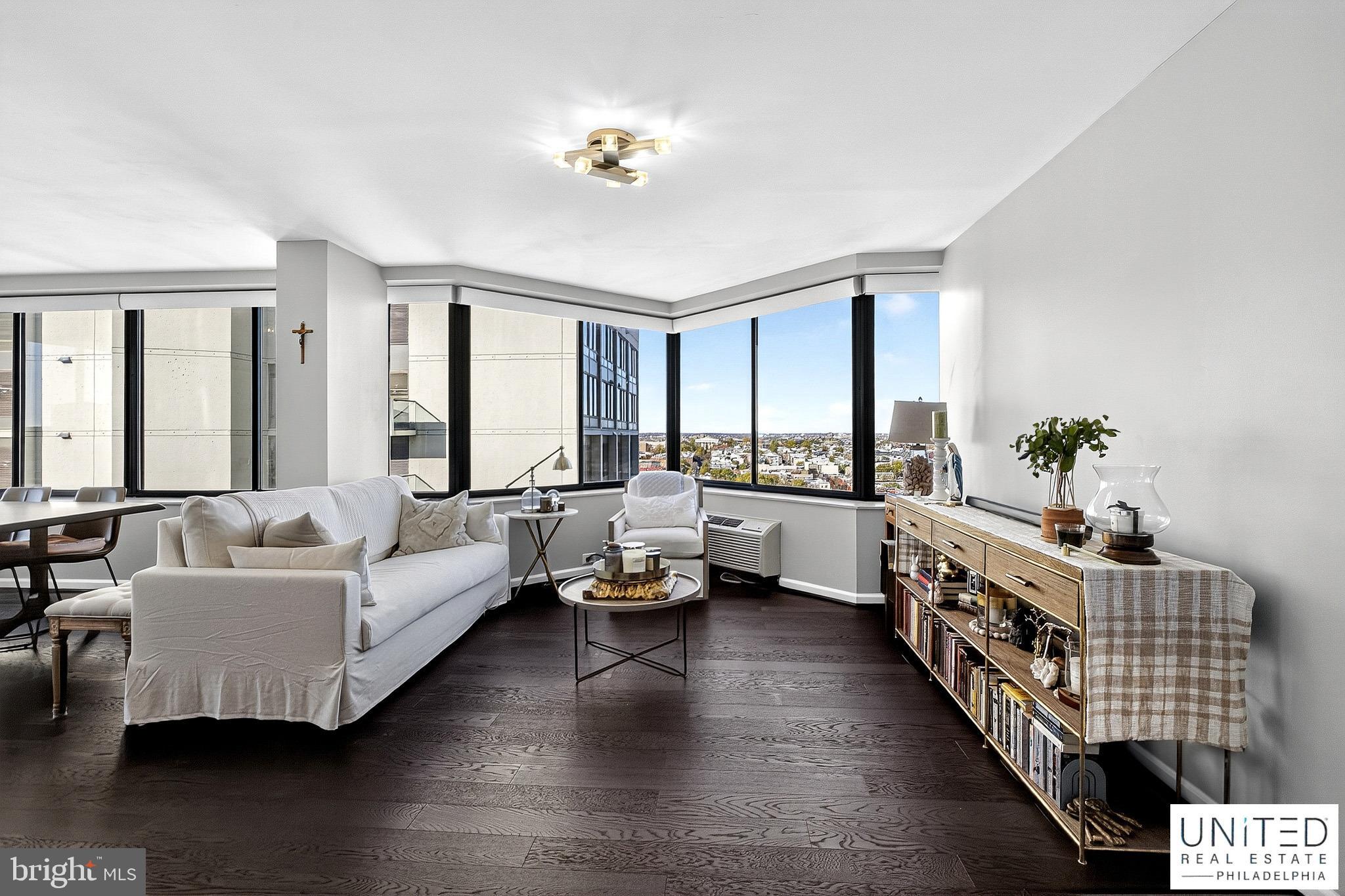 2001 Hamilton Street, Unit 2001 Philadelphia, PA 19130 - Photo 6 of 46 a living room with furniture and a large window