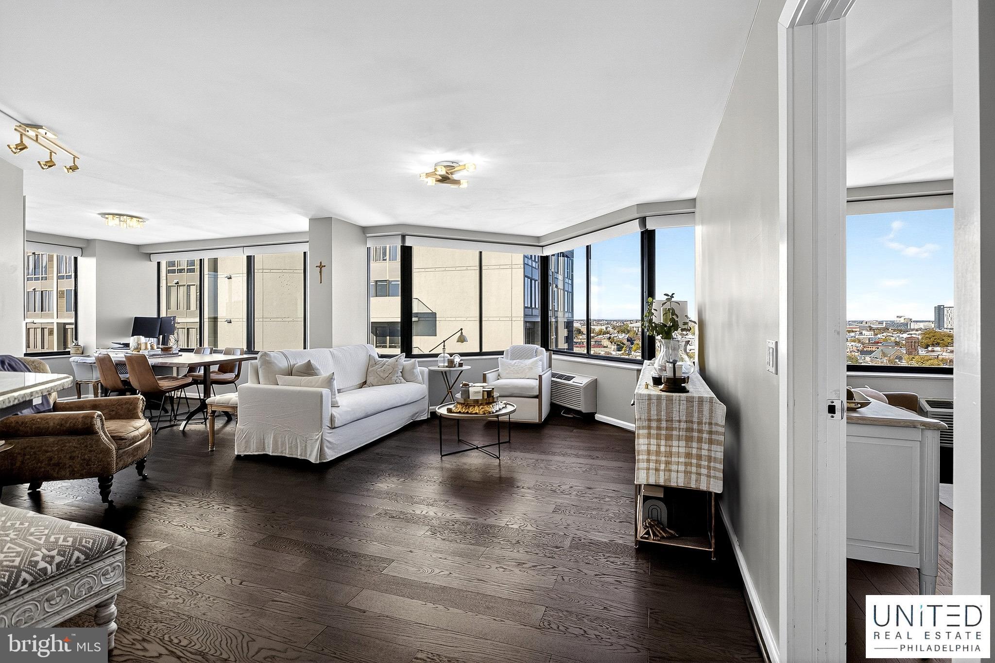 2001 Hamilton Street, Unit 2001 Philadelphia, PA 19130 - Photo 8 of 46 a living room with fireplace furniture and a wooden floor