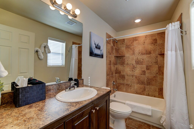 3853 South Red Valley Circle, Unit 22A1 Moab, UT 84532 - Photo 19 of 28 Bathroom featuring vanity, shower / bath combo, and light tile patterned floors