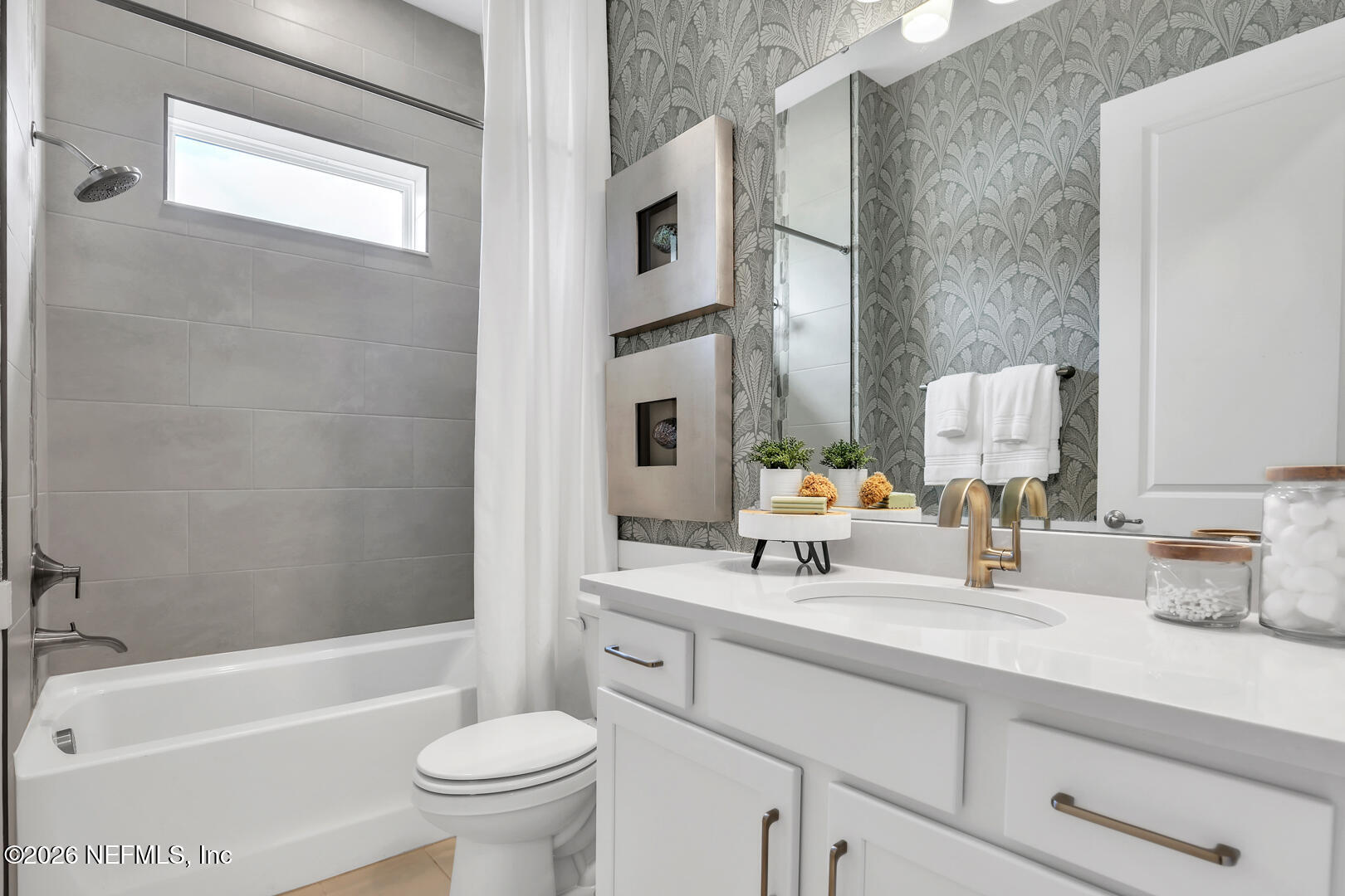 60 Ribera Drive Flagler Beach, FL 32136 - Photo 4 of 26 a bathroom with a sink a toilet and a bathtub