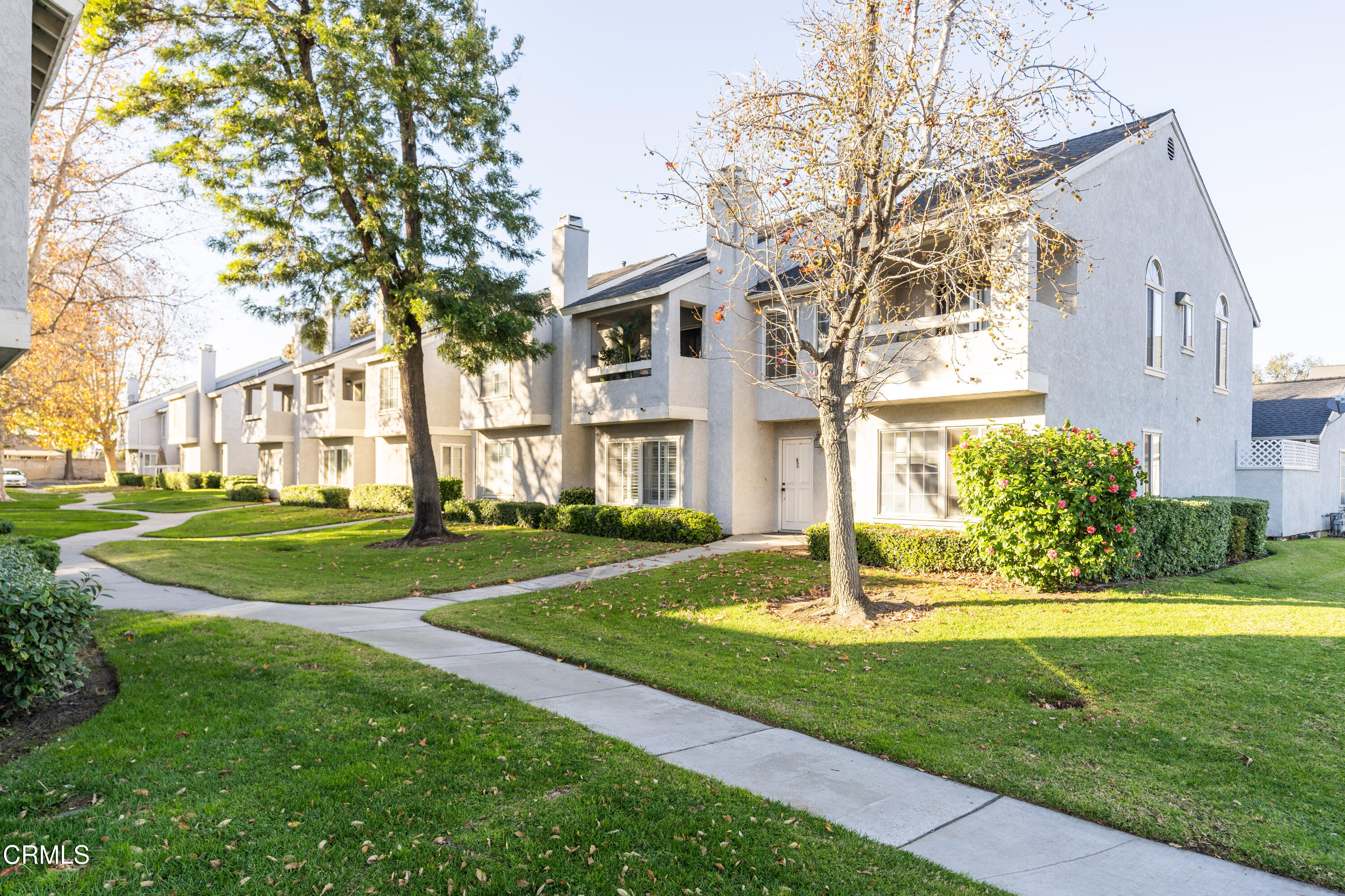 186 West Walnut Avenue, Unit E Rialto, CA 92376 - Photo 3 of 22 a front view of a house with a yard